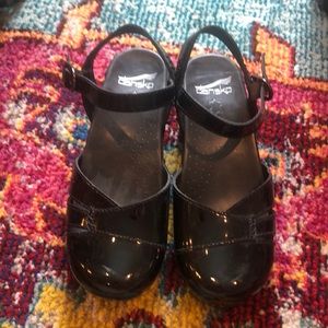 Dansko patent leather clogs